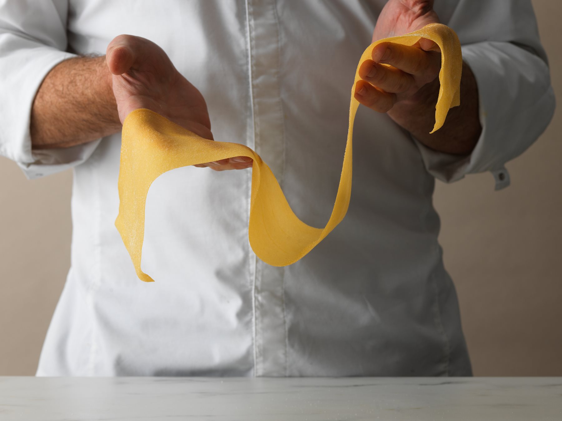 amare chef making pasta