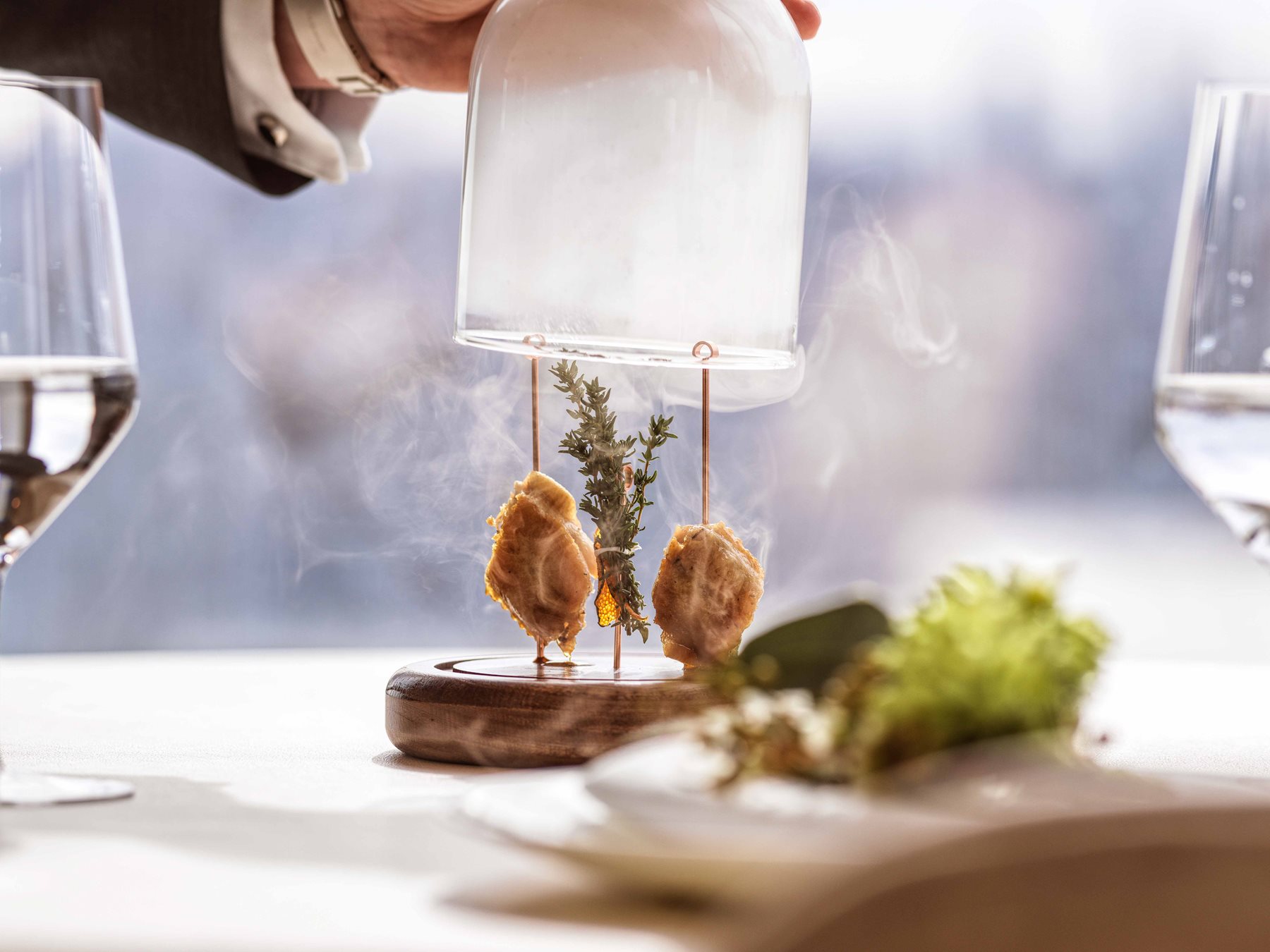 Special Entrée's, encased in a glass with steam billowing out
